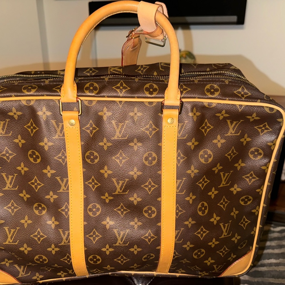 Authentic Louis Vuitton.